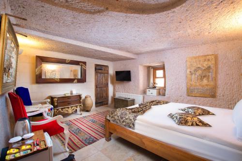 Кровать или кровати в номере Cappadocia Fairy Chimneys Selfie Cave Hotels - Special Class