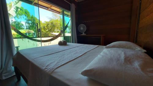 Ένα ή περισσότερα κρεβάτια σε δωμάτιο στο Monkey beach agroturismo