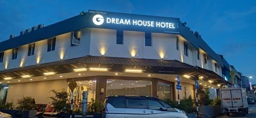 a car parked in front of a dream house hotel at Dream House Hotel in Skudai