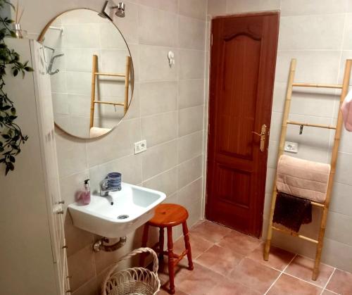 a bathroom with a sink and a mirror at Mi Parchita in Valverde