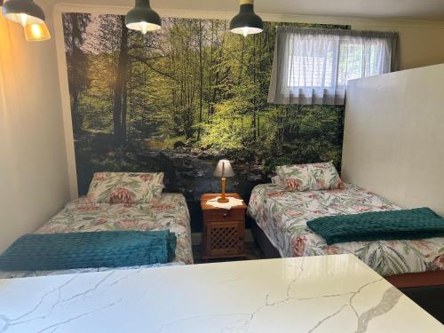 Un pat sau paturi într-o cameră la Green Cottage