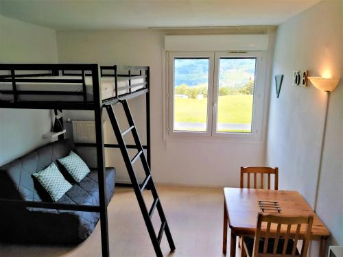 En eller flere senge i et værelse på Les Studios du Bois d'Aurouze