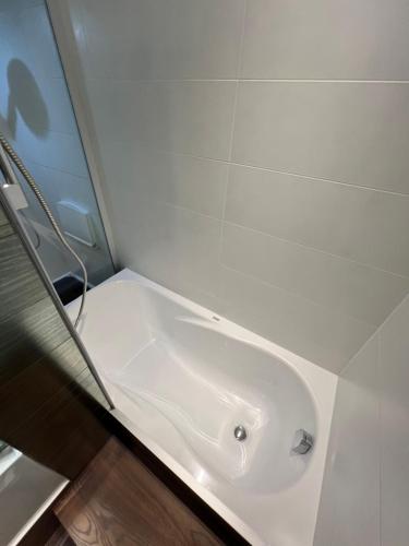 a bathroom with a white sink in a room at Apartament ZETA - CITY 2 in Ustroń