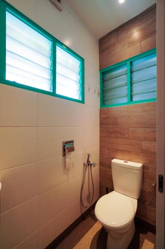 a bathroom with a toilet and a window at Dream & Wander Homestay in Ipoh