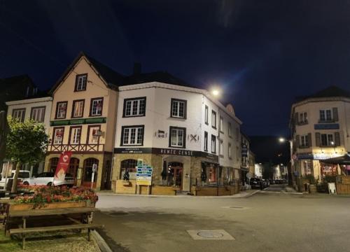 a group of buildings on a street at night at Renée Cense in Houffalize