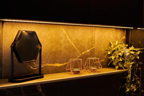 a shelf with three wine glasses on it at The Skyline Suite in Florina