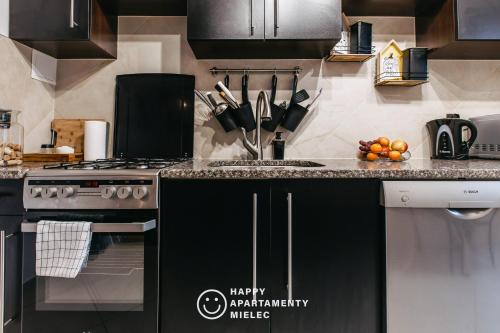 Η κουζίνα ή μικρή κουζίνα στο Happy Stay - ApartamentyHappy pl