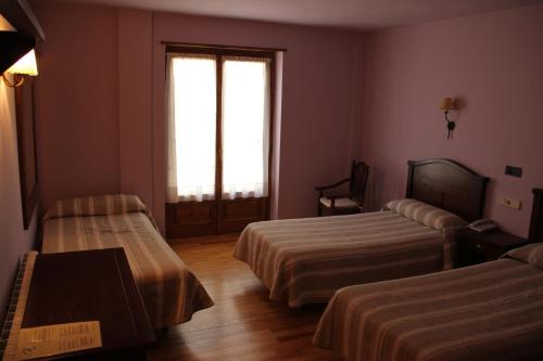 Postel nebo postele na pokoji v ubytování Hotel Rantiner
