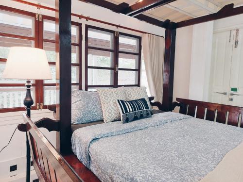 Ένα ή περισσότερα κρεβάτια σε δωμάτιο στο Green Riverside Homestay