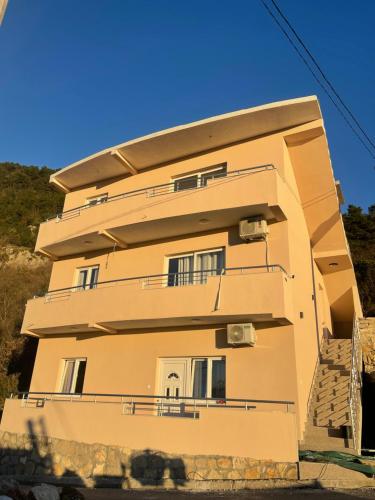 a building with balconies on the side of it at Apartments Tijana in Budva