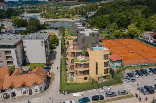 an overhead view of a city with cars parked in a parking lot at AS apartman Panonica in Tuzla