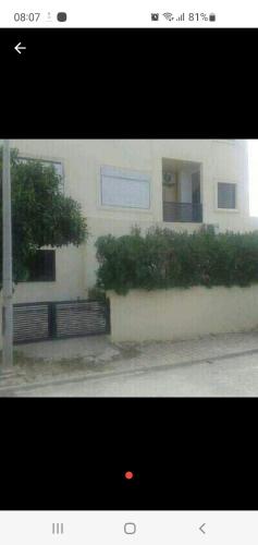 a picture of a building with a fence at Coquet RDC in Borj el Khessous