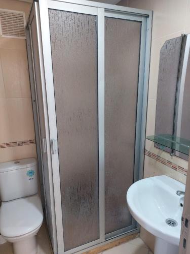 a bathroom with a shower and a toilet and a sink at BAHIA Sea View Exclusif pour Famille in Cabo Negro