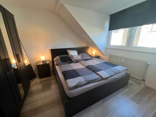 a bedroom with a large bed in a attic at City-Apartment in Wuppertal