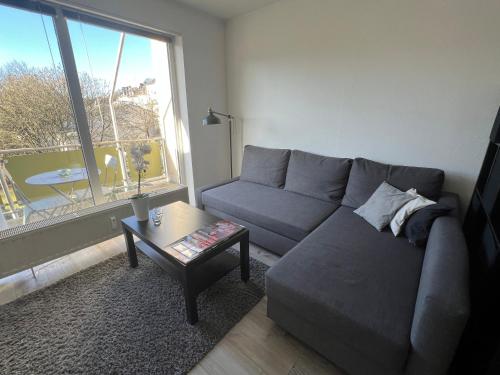 a living room with a couch and a table at City-Apartment in Wuppertal