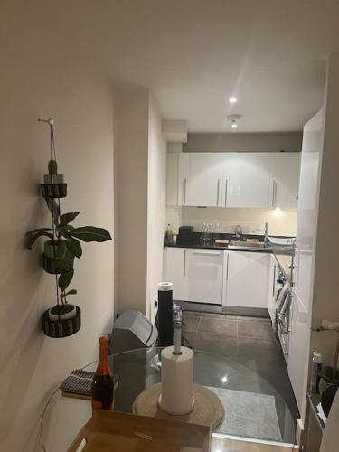 a small kitchen with a glass table in a room at 1 Bed flat in Central London in London
