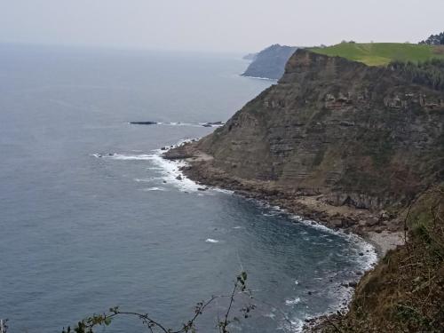 an aerial view of the ocean and a rocky coast at Casa María VUT 5614 AS in Villaviciosa
