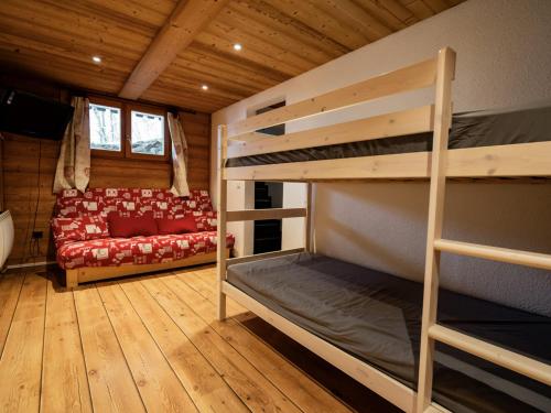a room with two bunk beds and a couch at Bel Appartement 3 Pièces avec Balcon, Proche Centre Châtel, Parking et Connexion WiFi - FR-1-676-119 in Châtel