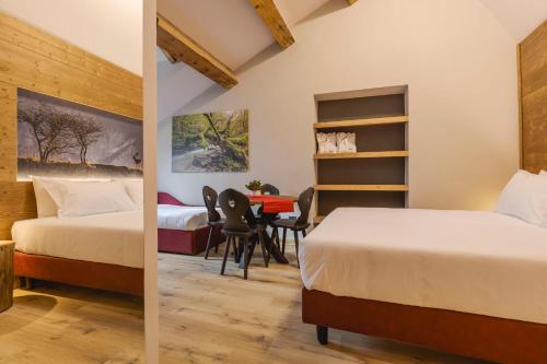 Postel nebo postele na pokoji v ubytování Granduca Mountain Wellness Apartments Campigna