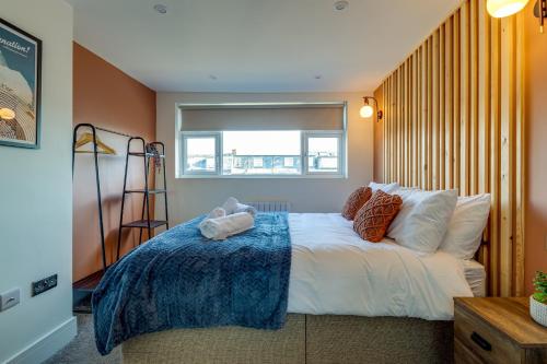 a bedroom with a bed and a window at Apt 4 North Marine Villa in Scarborough
