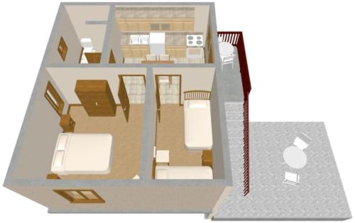 a floor plan of a house with furniture at Apartmani Frakić in Veli Rat