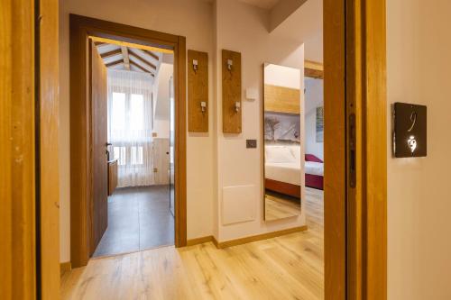 Postel nebo postele na pokoji v ubytování Granduca Mountain Wellness Apartments Campigna