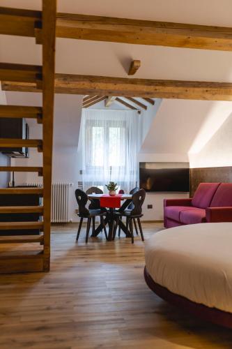 Postel nebo postele na pokoji v ubytování Granduca Mountain Wellness Apartments Campigna