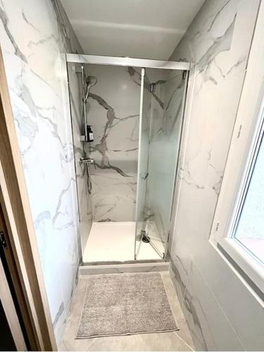 a shower with a glass door in a bathroom at Villa Victoria #8 persons #3 Bedrooms #Terrace # garage Beach - Calm and Clim in Roquebrune-Cap-Martin