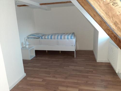 a bedroom with a bed in a attic at Gemütliche Ferienwohnung der Familie Hüther in Göttingen
