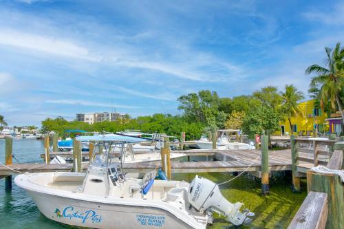 a boat docked at a dock in the water at Captain Pip's Marina & Hideaway in Marathon