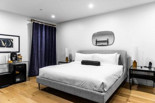 a bedroom with a bed with a suitcase on it at King Bed, The Phenix Historic DWTN Hotel, Room # 304 in Bangor