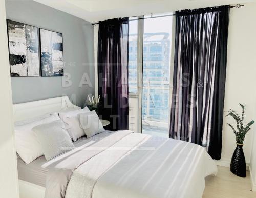 Katil atau katil-katil dalam bilik di The Bahamas and Maldives Suites at Azure Residences near Manila Airport