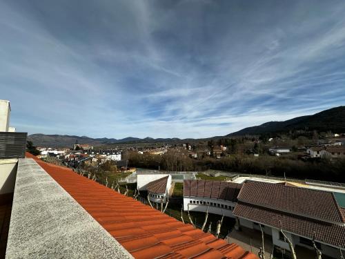 a view of a city from the roof of a building at Piso centrico en El Espinar in El Espinar