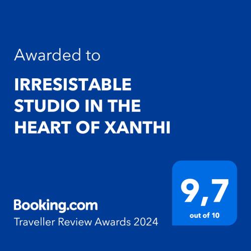 a blue sign with the text translated to irresistible studio in the heart of kant at IRRESISTABLE STUDIO IN THE HEART OF XANTHI in Xanthi