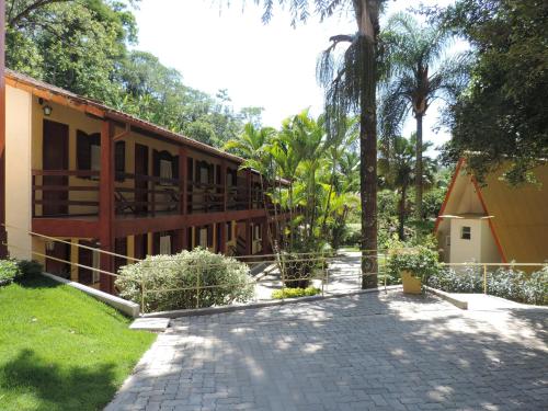 a building with a walkway in front of it at Hotel Fazenda Vilarejo All Inclusive in Conservatória