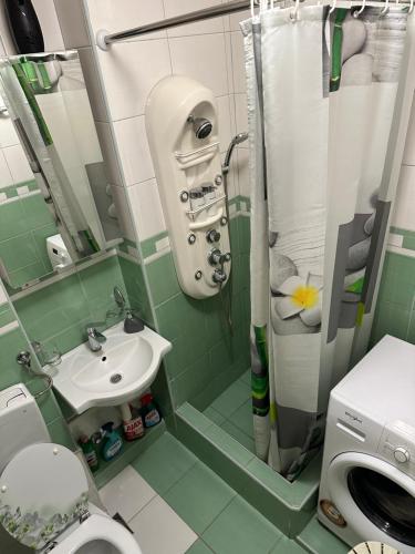 a small bathroom with a sink and a toilet at Podgorica Great location in Podgorica