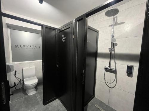 a bathroom with a shower and a toilet at Mickitos Urban Hostel in Skopje