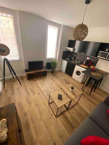 an aerial view of a living room with a wooden floor at Laurema's BnB in Toulouse