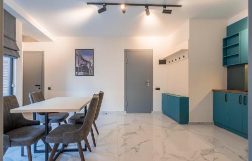 a dining room with a table and chairs at Luxury X By Umbrella in Tbilisi City