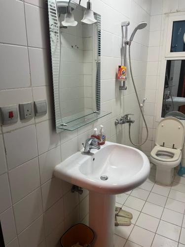a bathroom with a sink and a toilet at ابراج المسارات in Jeddah