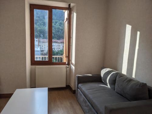 Χώρος καθιστικού στο Appartement et salle de jeu