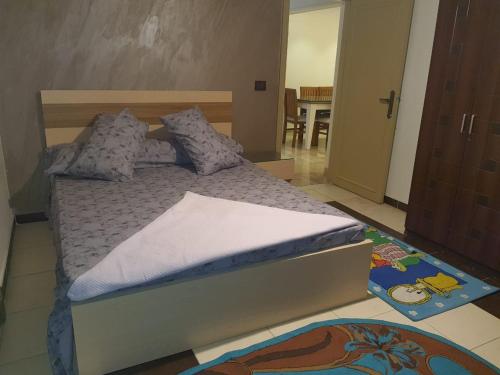 a bedroom with a bed and a room with a table at City Square in Alexandria