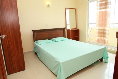 Ένα ή περισσότερα κρεβάτια σε δωμάτιο στο Wellawatte home inn