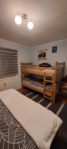a bedroom with two bunk beds in it at Apartman Jonjić in Kupres