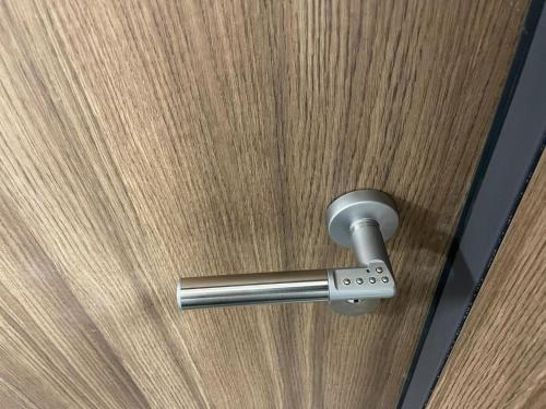 a close up of a door with a metal handle at Premium Apartment Victoria 141 in Warsaw