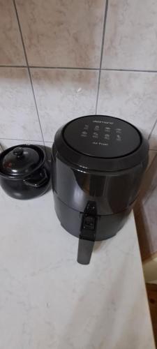 a black pot sitting on top of a counter at Apartman Jonjić in Kupres