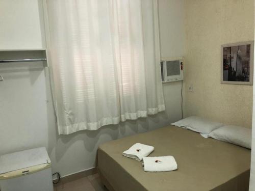 Postel nebo postele na pokoji v ubytování Hotel Natal