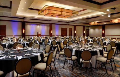 a ballroom with tables and chairs in a room at Wyndham Atlanta Buckhead Hotel & Conference Center in Atlanta