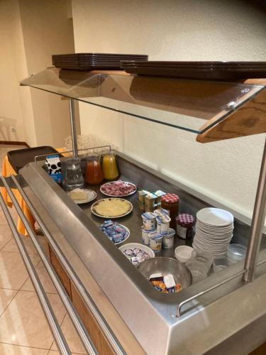 a counter in a kitchen with food on it at HOTEL DE LA GARE in Bar-le-Duc