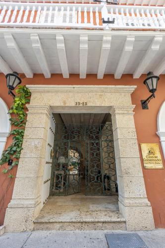 an entrance to a building with a metal gate at Hotel Casa del Gobernador in Cartagena de Indias